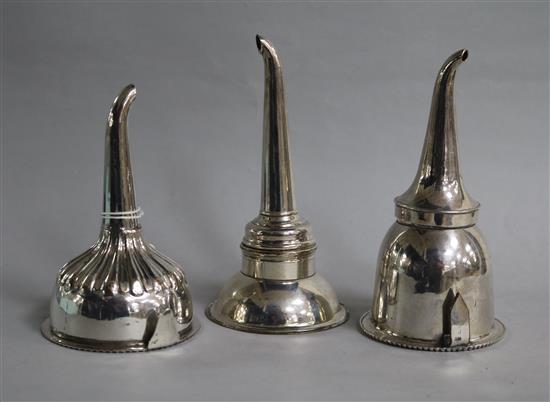 Three silver plated wine funnels including two 19th century Sheffield plate funnels, largest 16cm.